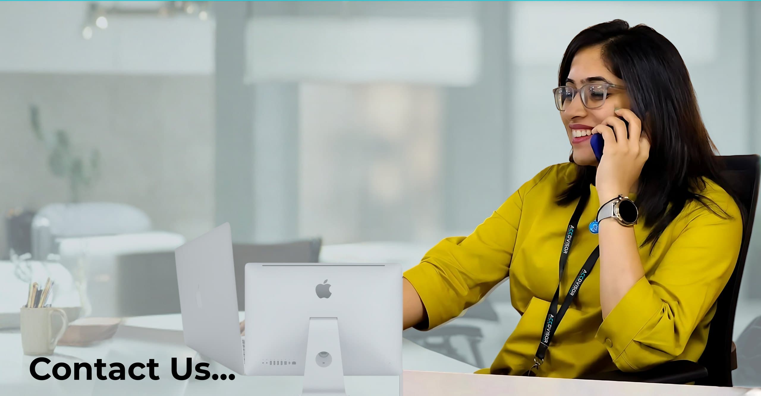 An Accdvisor team member taking a call at her desk