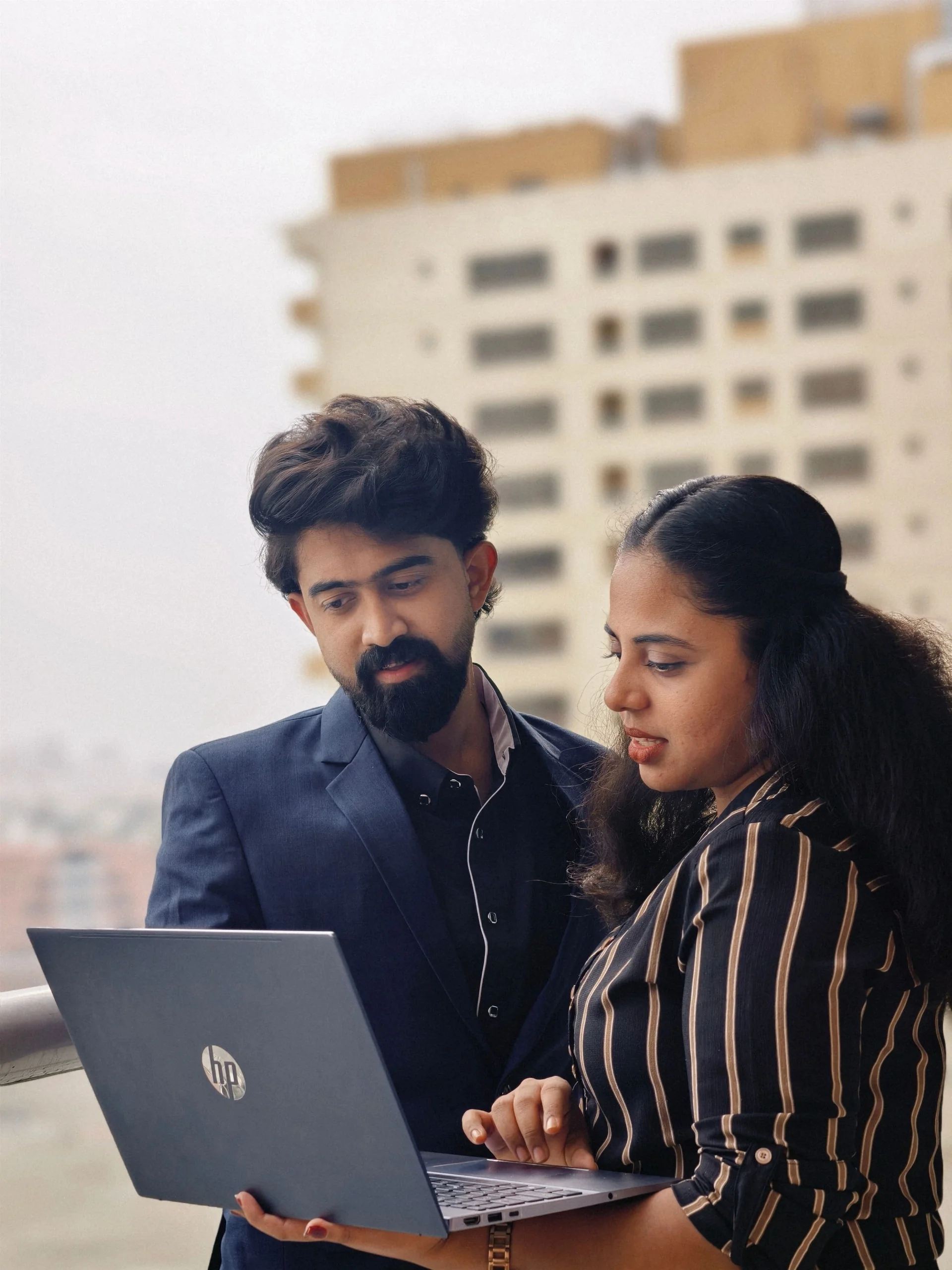 Accdvisor professionals reviewing work on a laptop